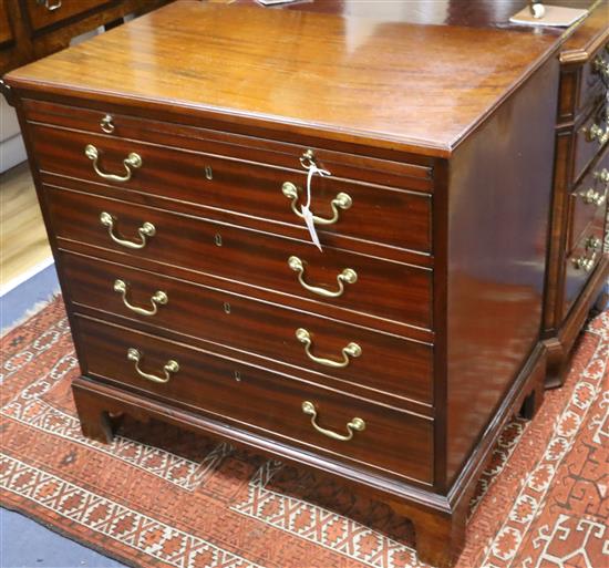 A small George III mahogany chest with brushing slide W.84cm